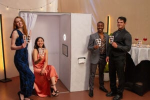 Casa Enclosed Photo Booth – Nostalgic Prints for Events Guests showing printed photo strips from Casa enclosed photo booth at an event, highlighting portability and nostalgic enclosed booth experiences