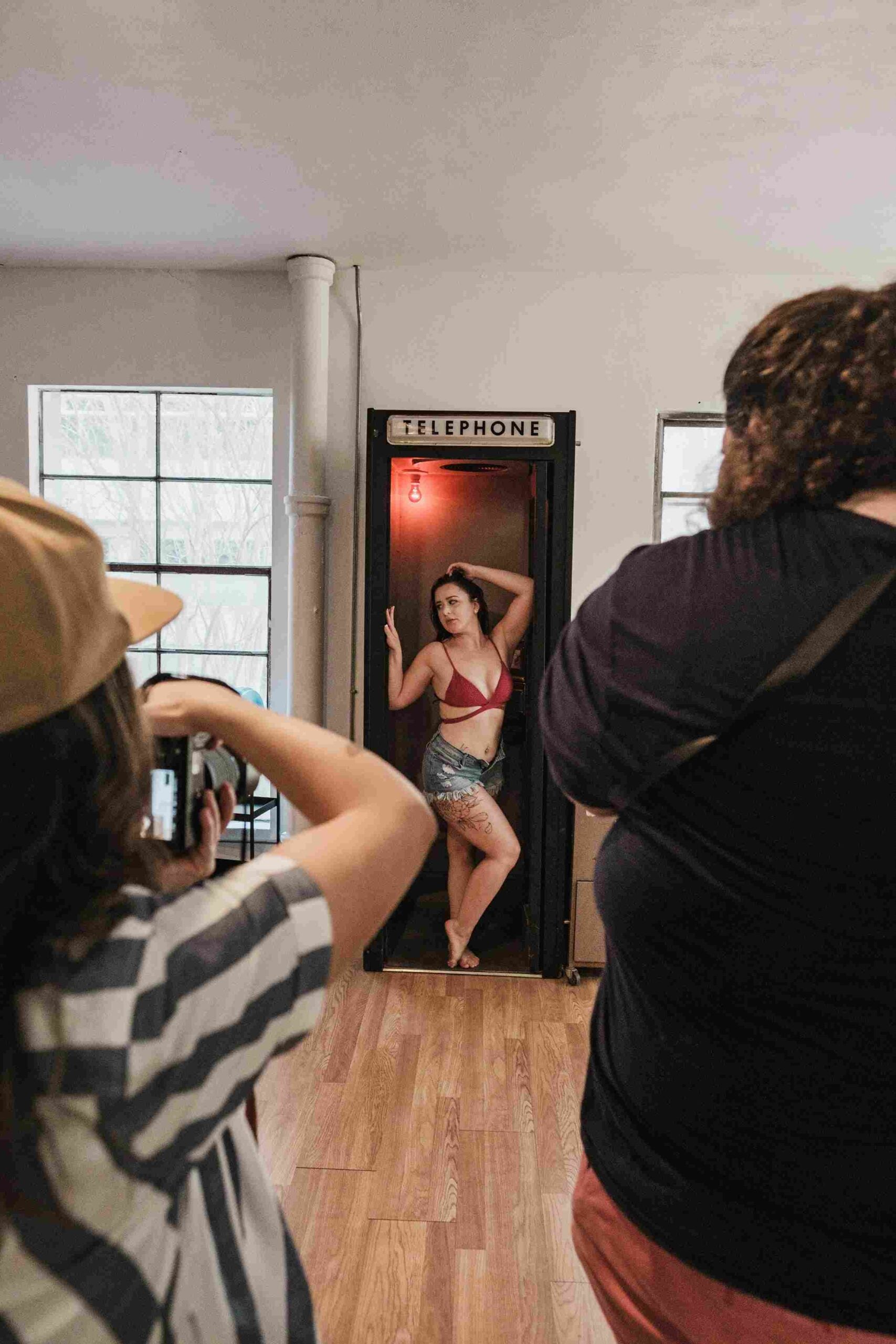 Portable photo booth setup at an event, showing a compact, enclosed unit with integrated lighting and tablet interface ready for guest use.